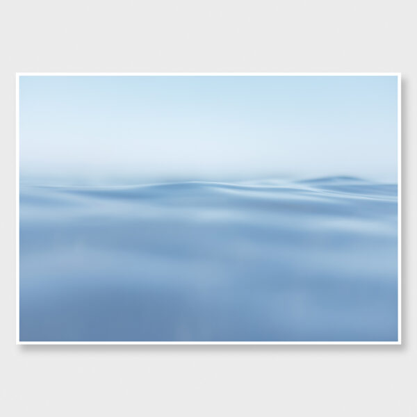 Soft-focus image of calm blue ocean blending seamlessly into the sky.