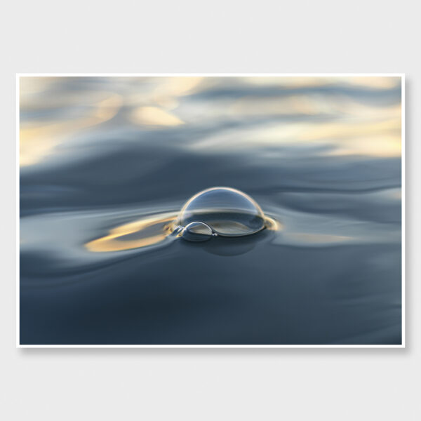 Ocean surface at Ōhope Beach, New Zealand with a fleeting bubble in soft light.