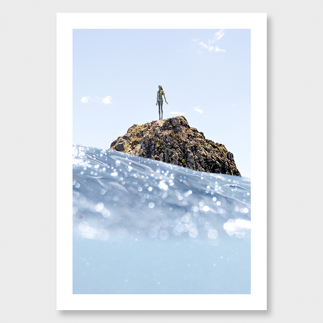 Fine art ocean photograph of the Lady on the Rock (Wairaka) in Whakatāne, captured from sea level with shifting light and water.