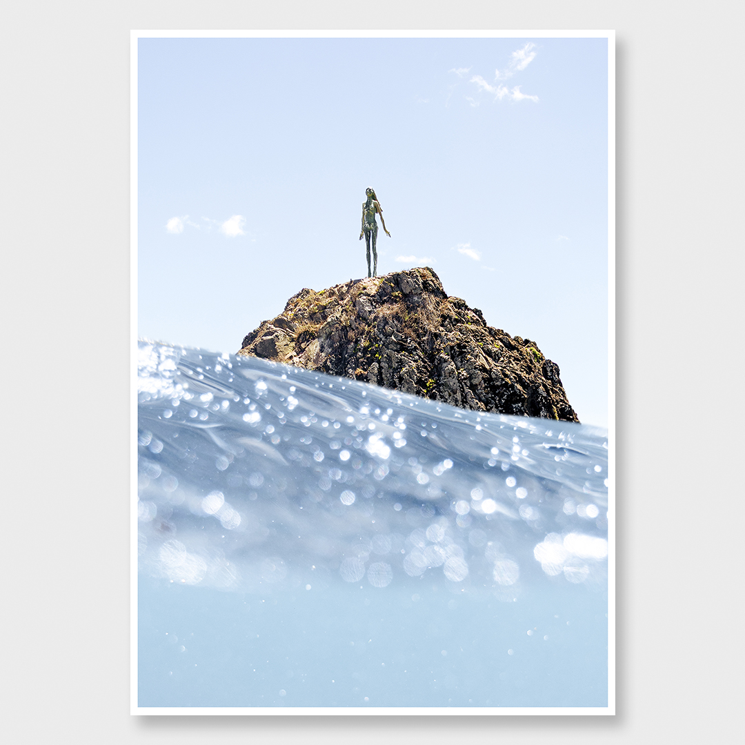 Fine art ocean photograph of the Lady on the Rock (Wairaka) in Whakatāne, captured from sea level with shifting light and water.